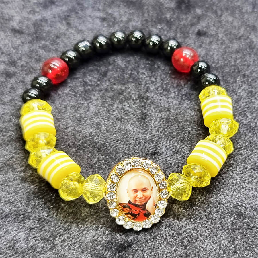 Crushed Yellow and Black Beads Bracelet with Jai Guruji Swaroop